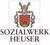Familienwappen der Familie Heuser mit Schriftzug Unternehmensgruppe Sozialwerk Heuser seit 1957